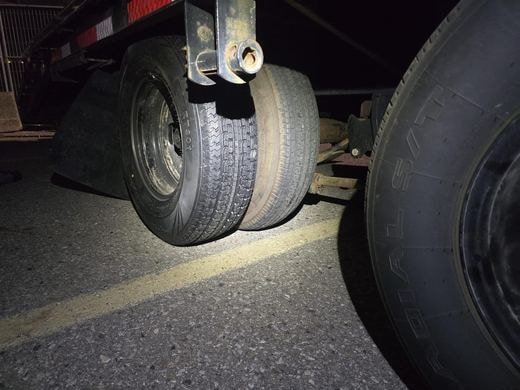 Trailer dual tire service at night