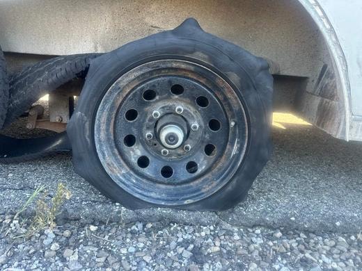 Blown trailer tire replaced roadside